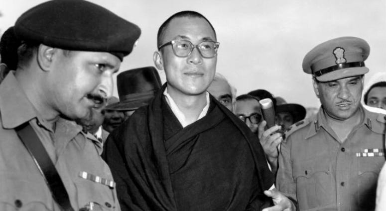 FILE - In this April 18, 1959, file photo, Tibetan spiritual leader the Dalai Lama, center, arrives at Tezpur, Assam in India. FILE - In this April 18, 1959, file photo, Tibetan spiritual leader the Dalai Lama, center, arrives at Tezpur, Assam in India.