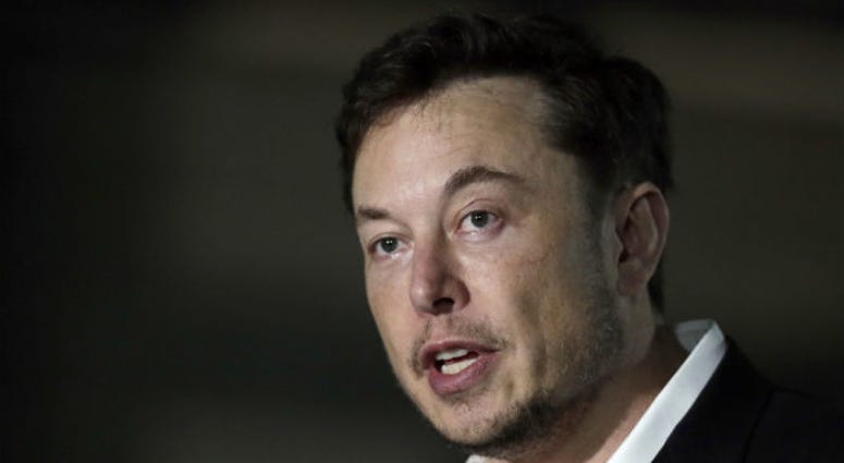 FILE - In this June 14, 2018, file photo, Tesla CEO Elon Musk speaks at a news conference in Chicago. FILE - In this June 14, 2018, file photo, Tesla CEO Elon Musk speaks at a news conference in Chicago.