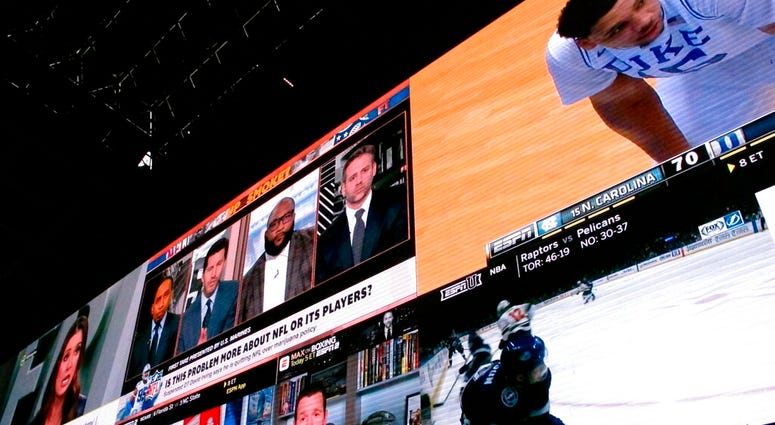 This March 8, 2019 photo shows giants video screens inside the sports betting lounge at the Tropicana casino in Atlantic City N.J. sports betting in Atlantic City