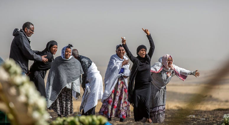 Ethiopian relatives of crash victims grieve at the site where the Ethiopian Airlines Boeing 737 Max 8 crashed shortly after takeoff on Sunday killing all 157 on board, near Bishoftu, south-east of Addis Ababa, in Ethiopia, on Thursday, March 14, 2019. Ethiopian relatives of crash victims grieve at the site where the Ethiopian Airlines Boeing 737 Max 8 crashed shortly after takeoff on Sunday killing all 157 on board, near Bishoftu, south-east of Addis Ababa, in Ethiopia, on Thursday, March 14, 2019.