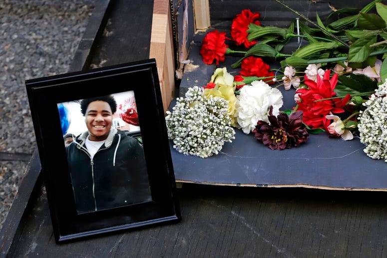A photo of Antwon Rose II sits with a memorial display for Rose II in front of the Allegheny County courthouse on the second day of the trial for Michael Rosfeld, a former police officer in East Pittsburgh, Pa., Wednesday, March 20, 2019. Antwon Rose II