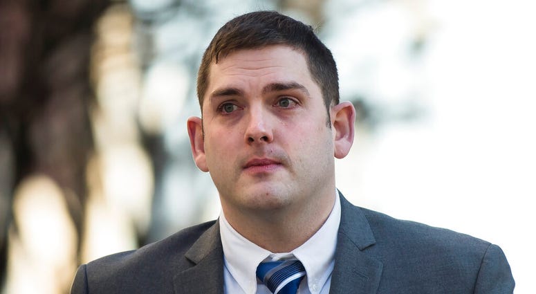 In this March 12, 2019 file photo, former East Pittsburgh police officer Michael Rosfeld, charged with homicide in the shooting death of Antwon Rose II, walks to the Dauphin County Courthouse in Harrisburg, Pa. Michael Rosfeld