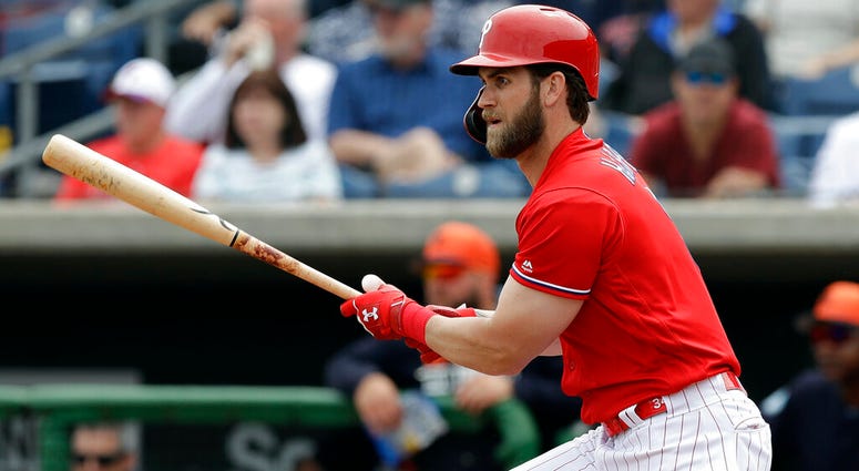 Philadelphia Phillies' Bryce Harper watches his single off Detroit Tigers starting pitcher Spencer Turnbull during the fourth inning of a spring training baseball game Wednesday, March 20, 2019, in Clearwater, Fla. Bryce Harper
