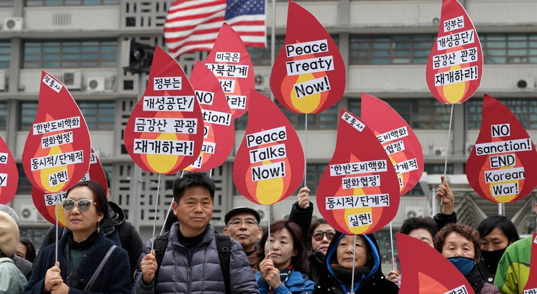 Protesters hold signs during a rally demanding the denuclearization of the Korean Peninsula and peace treaty near the U.S. embassy in Seoul, South Korea, Thursday, March 21, 2019. Protesters hold signs during a rally demanding the denuclearization of the Korean Peninsula and peace treaty near the U.S. embassy in Seoul, South Korea, Thursday, March 21, 2019.