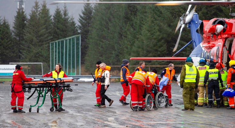 Passengers are helped from a rescue helicopter in Fraena, Norway, Sunday March 24, 2019, after being rescued from the Viking Sky cruise ship. Passengers are helped from a rescue helicopter in Fraena, Norway, Sunday March 24, 2019, after being rescued from the Viking Sky cruise ship.