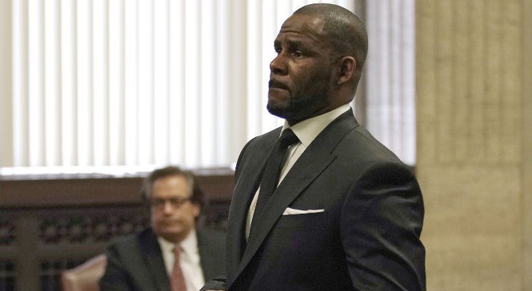 FILE - In this Friday, March 22, 2019 file photo, R. Kelly appears for a hearing at the Leighton Criminal Court Building in Chicago, Illinois. Dubai’s government on Sunday forcefully denied a claim by R&B singer R. Kelly that the artist had planned concerts in the sheikhdom after he had sought permission from an Illinois judge to travel here despite facing sexual-abuse charges.