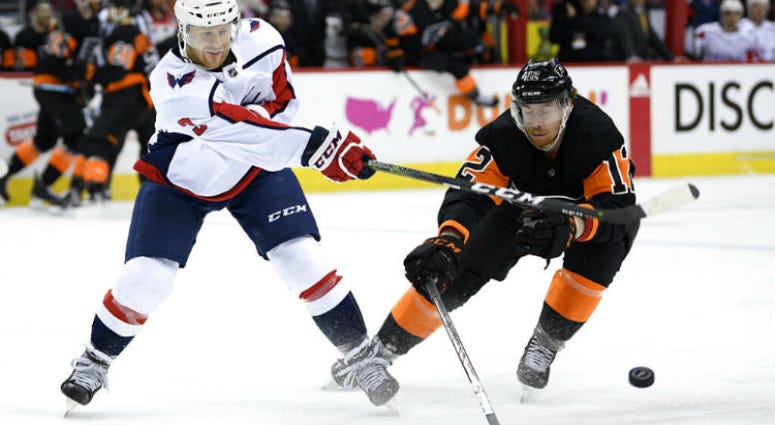 Philadelphia Flyers right wing Jakub Voracek (93), of the Czech Republic, collides with Washington Capitals goaltender Braden Holtby (70) during the second period of an NHL hockey game, Sunday, March 24, 2019, in Washington. Philadelphia Flyers right wing Jakub Voracek (93), of the Czech Republic, collides with Washington Capitals goaltender Braden Holtby (70) during the second period of an NHL hockey game.