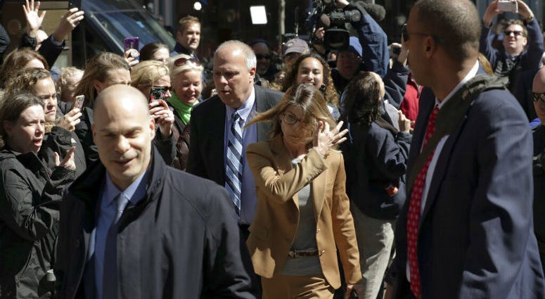 People photograph actress Lori Loughlin as she arrives at federal court in Boston on Wednesday, April 3, 2019, to face charges in a nationwide college admissions bribery scandal. People photograph actress Lori Loughlin as she arrives at federal court in Boston on Wednesday, April 3, 2019, to face charges in a nationwide college admissions bribery scandal.