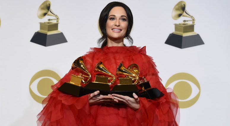 FILE - In this Feb. 10, 2019 file photo, Kacey Musgraves, winner of the awards for best country album for "Golden Hour", best country song for "Space Cowboy", best country solo performance for "Butterflies" and album of the year for "Golden Hour" poses in \Kacey Musgraves, winner of the awards for best country album for "Golden Hour", best country song for "Space Cowboy", best country solo performance for "Butterflies" and album of the year for "Golden Hour" poses in