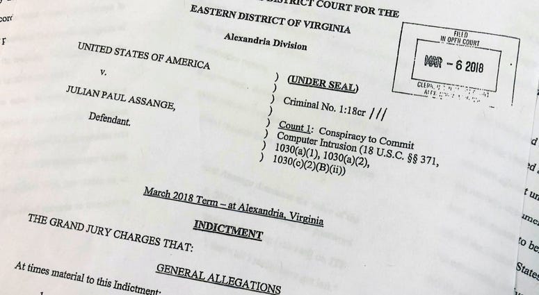 The Grand Jury Indictment against Julian Assange, released by the U.S. Department of Justice, Thursday, April 11, 2019, is photographed in Washington. The Grand Jury Indictment against Julian Assange, released by the U.S. Department of Justice, Thursday, April 11, 2019, is photographed in Washington.