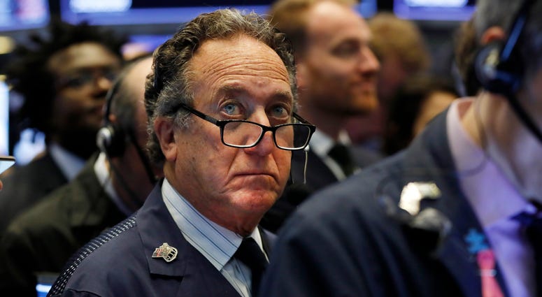 In this April 12, 2019, file photo trader Steven Kaplan works on the floor of the New York Stock Exchange. The U.S. stock market opens at 9:30 a.m. EDT on Monday, April 22. Trader Steven Kaplan works on the floor of the New York Stock Exchange.