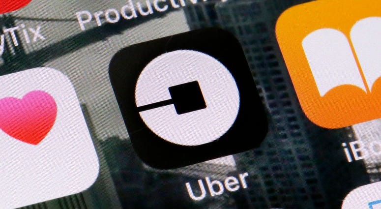 This Tuesday, June 12, 2018, file photo shows the Uber app on a phone in New York. Uber app