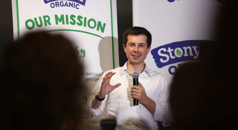 In this April 19, 2019, photo, Democratic presidential candidate South Bend Mayor Pete Buttigieg answers questions from employees during a campaign stop at a dairy company in Londonderry, N.H. Pete Buttigieg