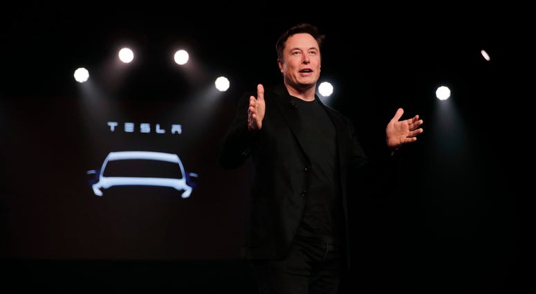 In this March 14, 2019, file photo Tesla CEO Elon Musk speaks before unveiling the Model Y at Tesla's design studio in Hawthorne, Calif. Tesla CEO Elon Musk