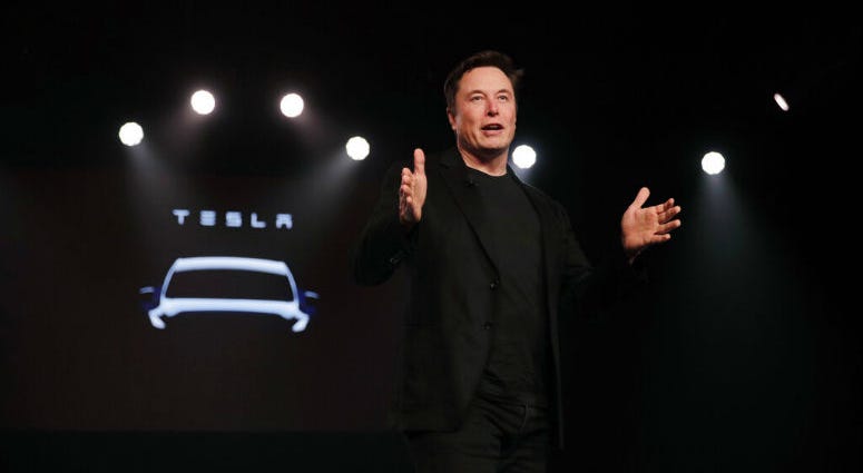 FILE- In this March 14, 2019, file photo Tesla CEO Elon Musk speaks before unveiling the Model Y at Tesla's design studio in Hawthorne, Calif. Elon Musk appears poised to transform the company’s electric cars into driverless vehicles in a risky bid to realize a bold vision that he has been floating for years.