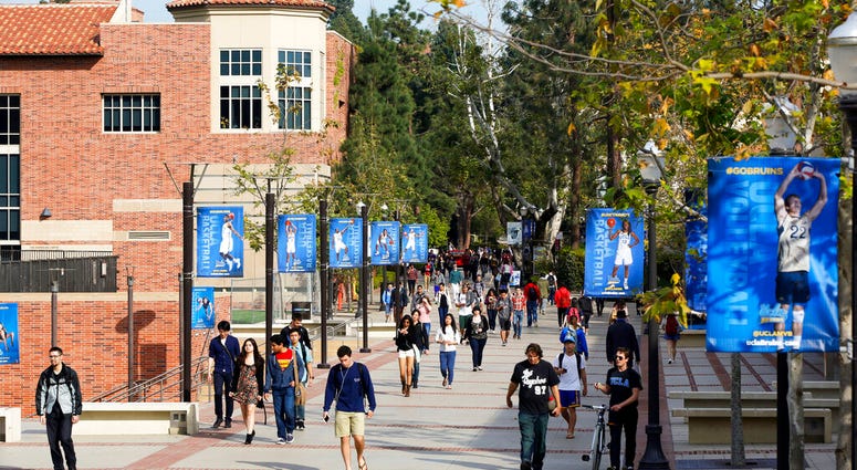 FILE - This Feb. 26, 2015 file photo shows students on the University of California, Los Angeles campus. A quarantine order was issued Thursday, April 25, 2019, for hundreds of students and staff at two Los Angeles universities who may have been exposed to measles and either have not been vaccinated or can't verify that they have immunity.