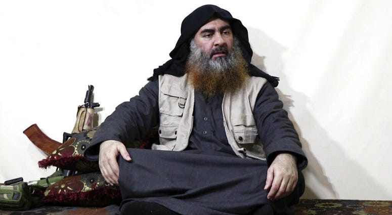 This image made from video posted on a militant website on Monday, April 29, 2019, purports to show the leader of the Islamic State group, Abu Bakr al-Baghdadi, being interviewed by his group's Al-Furqan media outlet. Al-Baghdadi acknowledged in his first video since June 2014 that IS lost the war in the eastern Syrian village of Baghouz that was captured last month by the Kurdish-led Syrian Democratic Forces.