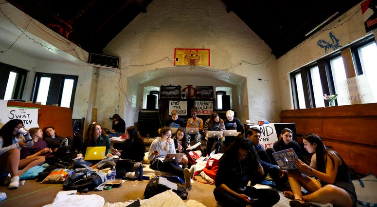 Swarthmore College students gather at the Phi Psi fraternity house during a sit-in, Monday, April 29, 2019, in Swarthmore, Pa. Swarthmore College students