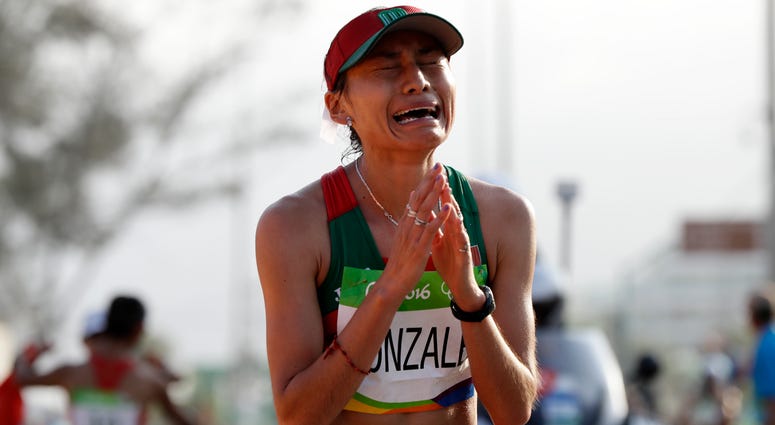 In this Friday, Aug. 19, 2016 file photo, Maria Guadalupe Gonzalez of Mexico, reacts after crossing the finish line in second place in the women's 20-km race walk at the 2016 Summer Olympics in Rio de Janeiro, Brazil. Maria Guadalupe Gonzalez