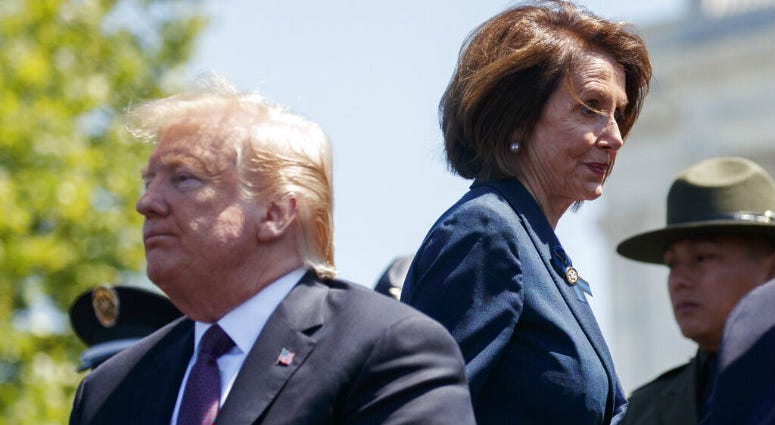 President Donald Trump and Speaker of the House Nancy Pelosi of Calif., attend the 38th Annual National Peace Officers' Memorial Service at the U.S. Capitol, Wednesday, May 15, 2019, in Washington. Pelosi said Wednesday that the U.S. must avoid war with Iran and she warned the White House has “no business” moving toward a Middle East confrontation without approval from Congress.