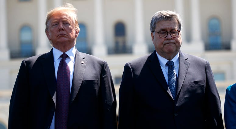President Donald Trump stands with Attorney General William Barr during the 38th Annual National Peace Officers' Memorial Service at the U.S. Capitol, Wednesday, May 15, 2019, in Washington. President Donald Trump stands with Attorney General William Barr.