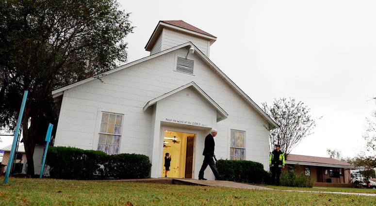 In this Nov. 12, 2017, file photo, a man walks out of the memorial for the victims of a shooting at Sutherland Springs First Baptist Church in Sutherland Springs, Texas. First Baptist Church in Sutherland Springs, Texas.