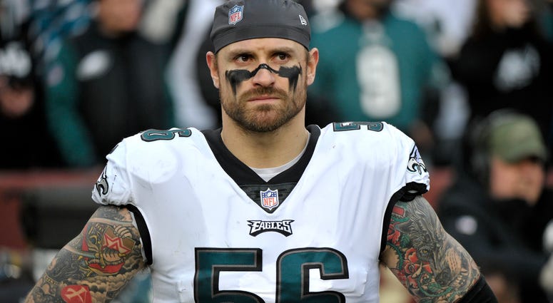 In this Dec. 30, 2018, file photo, Philadelphia Eagles defensive end Chris Long stands on the sideline prior to the team's NFL football game against the Washington Redskins in Landover, Md. Chris Long