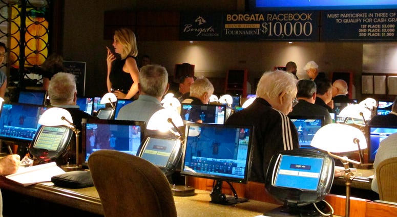 This June 14, 2018 file photo shows bettors waiting to make wagers on sporting events at the Borgata casino in Atlantic City hours after it began accepting sports bets. Borgata casino in Atlantic City