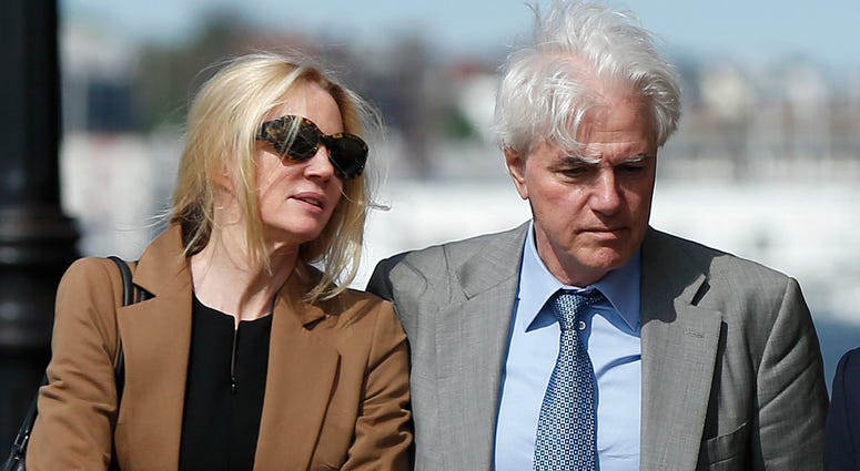Marcia, left, and Gregory Abbott leave federal court, Wednesday, May 22, 2019, in Boston, where they pleaded guilty to charges in a nationwide college admissions bribery scandal. Marcia, left, and Gregory Abbott