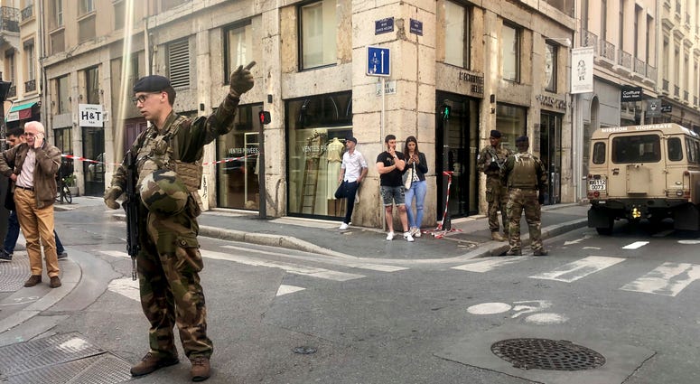 Soldiers of French anti terrorist plan "Vigipirate Mission", secure the area, near the site of a suspected bomb attack in central Lyon, Friday May, 24, 2019. Soldiers of French anti terrorist plan "Vigipirate Mission"