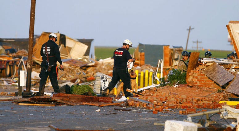Workers look through tornado damage at the American Budget Value Inn in El Reno, Okla., Sunday, May 26, 2019. The deadly tornado leveled a motel and tore through the mobile home park near Oklahoma City overnight Workers look through tornado damage at the American Budget Value Inn in El Reno, Okla., Sunday, May 26, 2019. The deadly tornado leveled a motel and tore through the mobile home park near Oklahoma City overnight