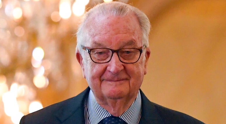 FILE - In this May 22, 2016, file photo, former Belgian King Albert II arrives for a tribute ceremony at the Royal Palace in Brussels for the victims of the Brussels attacks. Belgium’s former monarch Albert II has agreed to a DNA test demanded by a woman who claims to be his love child. King Albert II, who abdicated in 2013 for health reasons, is facing a daily fine of 5,000 euros ($5,600) for failing to provide his DNA in the