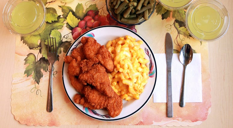 This undated photo provided by the National Institutes of Health in June 2019 shows an "ultra-processed" lunch including brand name macaroni and cheese, chicken tenders, canned green beans and diet lemonade. This undated photo provided by the National Institutes of Health in June 2019 shows an "ultra-processed" lunch including brand name macaroni and cheese, chicken tenders, canned green beans and diet lemonade.