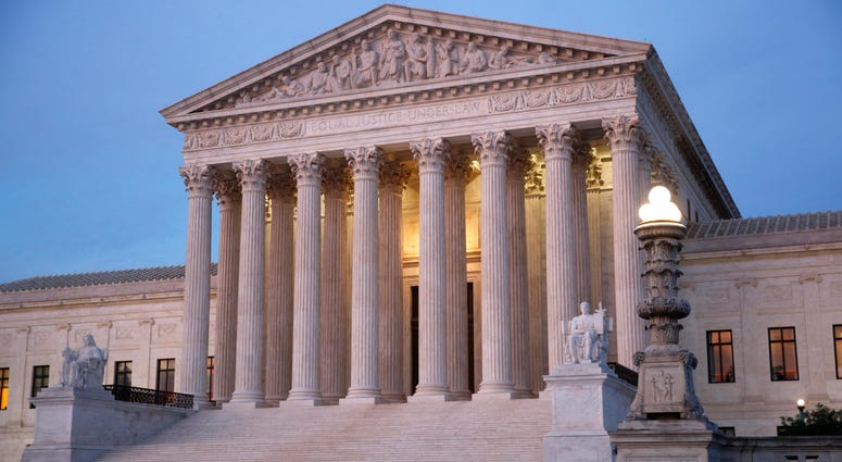In this May 23, 2019 photo, the U.S. Supreme Court building at dusk on Capitol Hill in Washington. In this May 23, 2019 photo, the U.S. Supreme Court building at dusk on Capitol Hill in Washington.