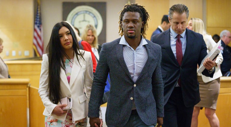 Philadelphia Phillies baseball player Odubel Herrera leaves a courtroom with his girlfriend, Melany Martinez-Angulo, after a hearing on a domestic violence case in Atlantic City, N.J., Wednesday, July 3, 2019. Odubel Herrera