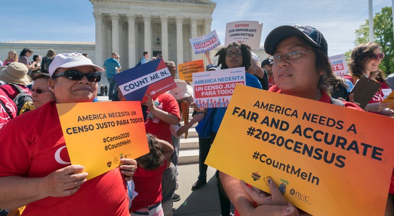 In this April 23, 2019 file photo, immigration activists rally outside the Supreme Court as the justices hear arguments over the Trump administration's plan to ask about citizenship on the 2020 census, in Washington. In this April 23, 2019 file photo, immigration activists rally outside the Supreme Court as the justices hear arguments over the Trump administration's plan to ask about citizenship on the 2020 census, in Washington.
