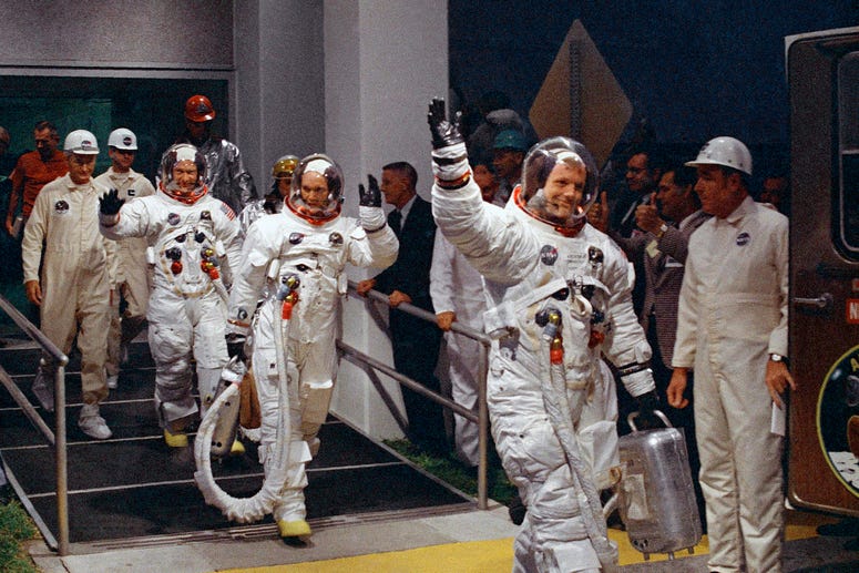 FILE - In this July 16, 1969 file photo, from right, Neil Armstrong, Michael Collins and Buzz Aldrin walk to the van that will take the crew to the launchpad at Kennedy Space Center on Merritt Island, Florida. FILE - In this July 16, 1969 file photo, from right, Neil Armstrong, Michael Collins and Buzz Aldrin walk to the van that will take the crew to the launchpad at Kennedy Space Center on Merritt Island, Florida.