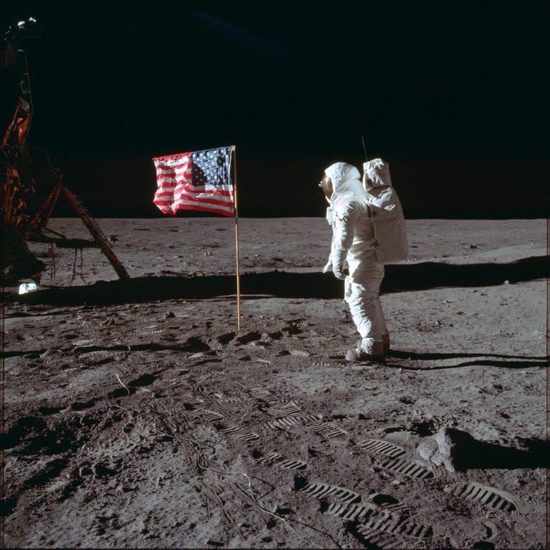 In this July 20, 1969 photo made available by NASA, astronaut Buzz Aldrin Jr. poses for a photograph beside the U.S. flag on the moon during the Apollo 11 mission. In this July 20, 1969 photo made available by NASA, astronaut Buzz Aldrin Jr. poses for a photograph beside the U.S. flag on the moon during the Apollo 11 mission.