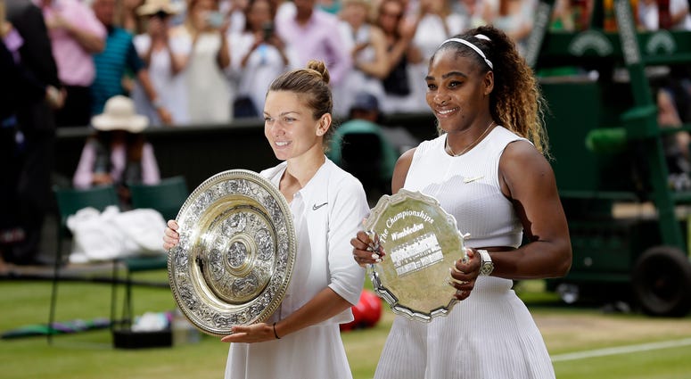Winner Romania's Simona Halep and second placed United States' Serena Williams, right, pose with their trophies after the women's singles final match on day twelve of the Wimbledon Tennis Championships in London, Saturday, July 13, 2019. Winner Romania's Simona Halep and second placed United States' Serena Williams, right, pose with their trophies after the women's singles final match on day twelve of the Wimbledon Tennis Championships in London, Saturday, July 13, 2019.