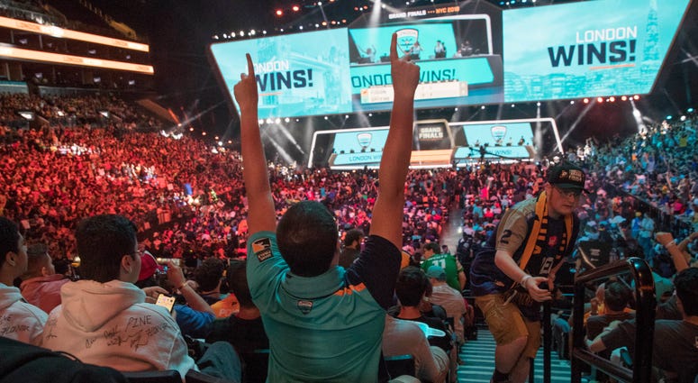 In this July 28, 2018, file photo, London Spitfire fan Rick Ybarra, of Plainfield, Ind., reacts after London won the second game against the Philadelphia Fusion during the Overwatch League Grand Finals competition at Barclays Center in New York. In this July 28, 2018, file photo, London Spitfire fan Rick Ybarra, of Plainfield, Ind., reacts after London won the second game against the Philadelphia Fusion during the Overwatch League Grand Finals competition at Barclays Center in New York.