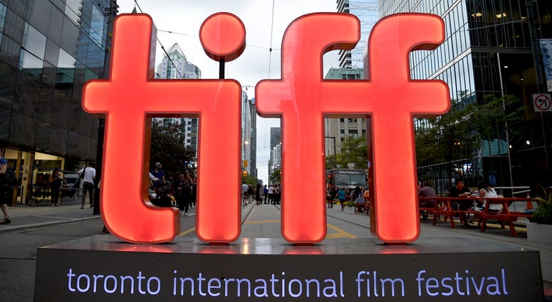 In this Thursday, Sept. 6, 2018, file photo, a view of a festival sign appears on Day 1 of the Toronto International Film Festival in Toronto. In this Thursday, Sept. 6, 2018, file photo, a view of a festival sign appears on Day 1 of the Toronto International Film Festival in Toronto.