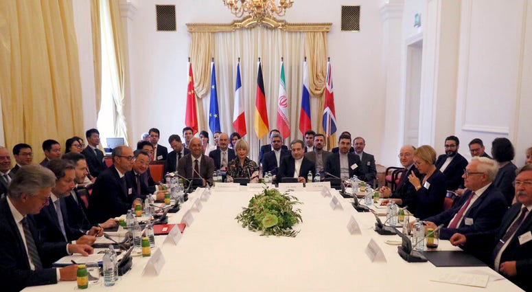The European Union's political director Helga Schmid and Iran's deputy Foreign Minister Abbas Araghchi, center from left, wait for a bilateral meeting as part of the closed-door nuclear talks with Iran at a hotel in Vienna, Austria, Sunday, July 28, 2019. The European Union's political director Helga Schmid and Iran's deputy Foreign Minister Abbas Araghchi, center from left, wait for a bilateral meeting as part of the closed-door nuclear talks with Iran at a hotel in Vienna, Austria, Sunday, July 28, 2019.