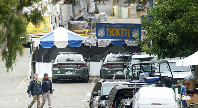 FBI personnel pass a ticket booth at the Gilroy Garlic Festival Monday, July 29, 2019 in Calif., the morning after a gunman killed at least three people, including a 6-year-old boy, and wounding about 15 others. FBI personnel pass a ticket booth at the Gilroy Garlic Festival Monday, July 29, 2019 in Calif., the morning after a gunman killed at least three people, including a 6-year-old boy, and wounding about 15 others.