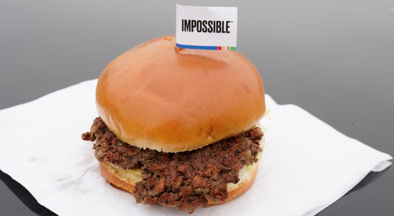 This Jan. 11, 2019, file photo shows the Impossible Burger, a plant-based burger containing wheat protein, coconut oil and potato protein among it's ingredients in Bellevue, Neb. This Jan. 11, 2019, file photo shows the Impossible Burger, a plant-based burger containing wheat protein, coconut oil and potato protein among it's ingredients in Bellevue, Neb.