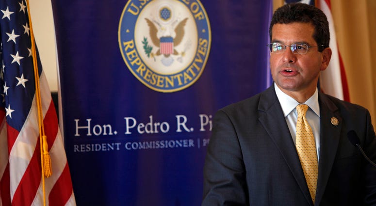 In this Sept. 24, 2013 file photo, Pedro Pierluisi, Puerto Rico's representative in the U.S. Congress, speaks during a conference in San Juan, Puerto Rico. In this Sept. 24, 2013 file photo, Pedro Pierluisi, Puerto Rico's representative in the U.S. Congress, speaks during a conference in San Juan, Puerto Rico.