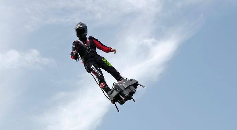 In this Wednesday July 24, 2019 file photo Franky Zapata, performs a training flight over the Saint Inglevert airport near Calais, Northern France. In this Wednesday July 24, 2019 file photo Franky Zapata, performs a training flight over the Saint Inglevert airport near Calais, Northern France.