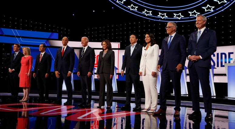 From left: Michael Bennet, Kirsten Gillibrand, Julian Castro, Cory Booker, Joe Biden, Kamala Harris, Andrew Yang, Tulsi Gabbard, Jay Inslee and Bill de Blasio are shown before the second of two Democratic debates Wednesday, July 31, 2019, in Detroit. From left: Michael Bennet, Kirsten Gillibrand, Julian Castro, Cory Booker, Joe Biden, Kamala Harris, Andrew Yang, Tulsi Gabbard, Jay Inslee and Bill de Blasio are shown before the second of two Democratic debates Wednesday, July 31, 2019, in Detroit.