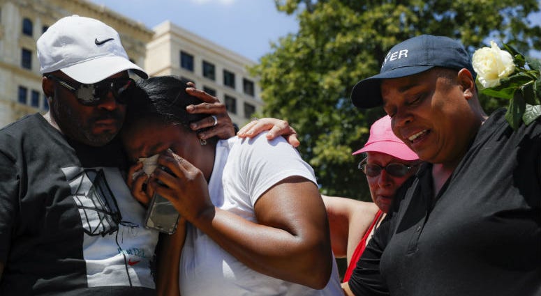 Mourners gather at a vigil following a nearby mass shooting, Sunday, Aug. 4, 2019, in Dayton, Ohio. Mourners gather at a vigil following a nearby mass shooting, Sunday, Aug. 4, 2019, in Dayton, Ohio.
