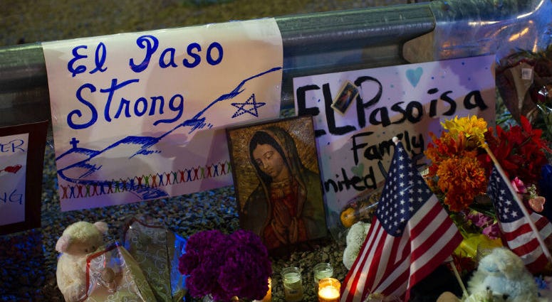 A Virgin Mary painting, flags and flowers adorn a makeshift memorial for the victims of Saturday's mass shooting at a shopping complex in El Paso, Texas, Sunday, Aug. 4, 2019. A Virgin Mary painting, flags and flowers adorn a makeshift memorial for the victims of Saturday's mass shooting at a shopping complex in El Paso, Texas, Sunday, Aug. 4, 2019.