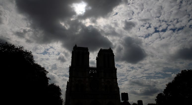 Notre Dame cathedral is silhouetted as environmental groups and unionists attend a news conference to warn against lead particles polluting the air in the area, and ask for a regularly updated chart showing pollution levels in Paris, France. Notre Dame cathedral is silhouetted as environmental groups and unionists attend a news conference to warn against lead particles polluting the air in the area, and ask for a regularly updated chart showing pollution levels in Paris, France.